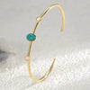 Elegant thin gold cuff bracelet with natural turquoise and opal stones Elegant thin gold cuff bracelet with natural turquoise and opal stones